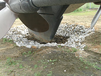 lining the area around the rudder with stone