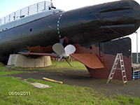 sandblasting and priming of lower port stern